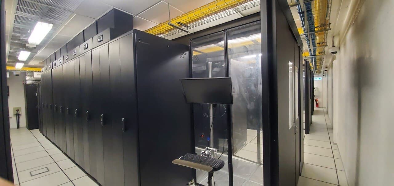 Secure server racks with pull-out hardware mounting tray in climate-controlled Hong Kong data center
