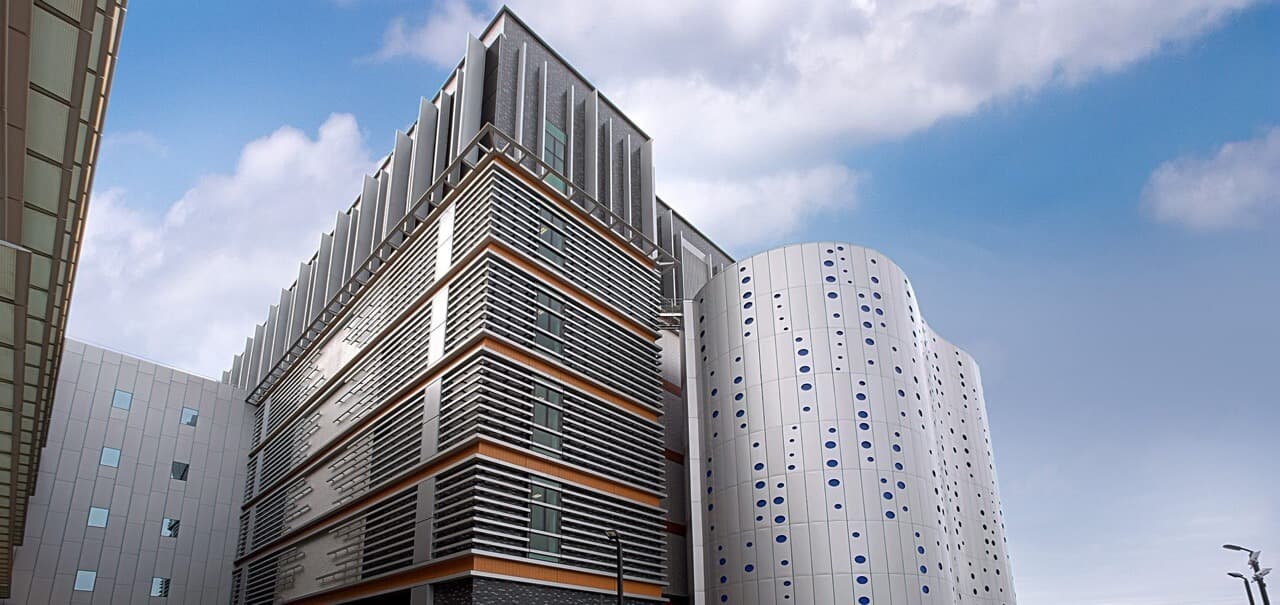 Contemporary data center exterior with distinctive horizontal ventilation panels, curved architectural elements and cloud-optimized infrastructure design