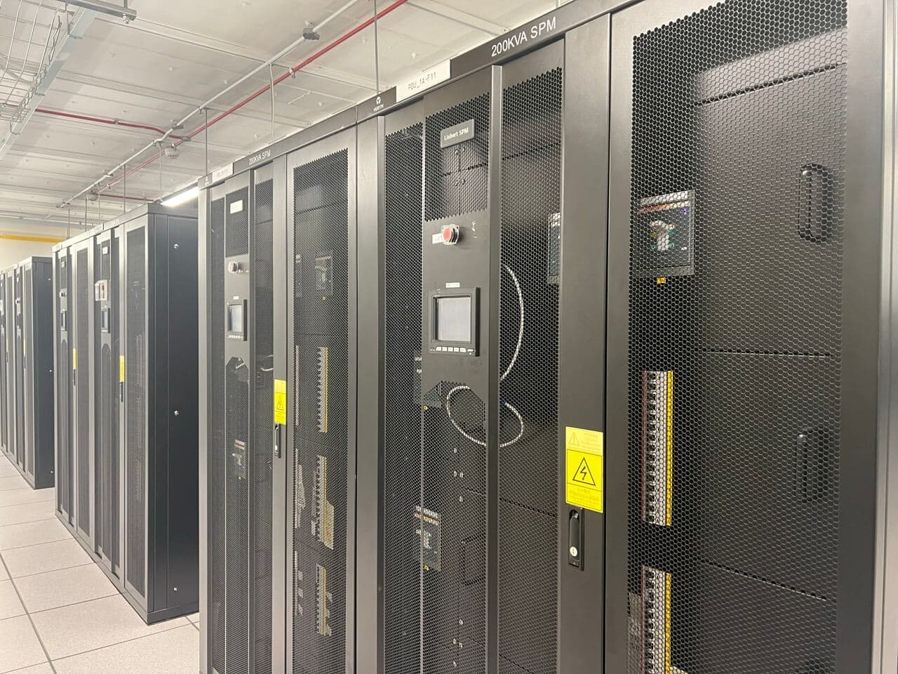 Secure server rack corridor in enterprise data center powering cloud and web hosting services
