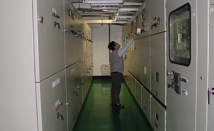 Technician inspecting systems in a data center