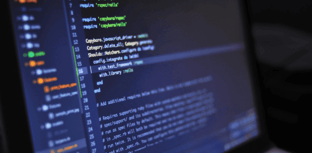 Close-up of computer screen displaying code in a text editor. Lines of colorful code indicate a programming environment, conveying a focused, tech-savvy mood. Close-up of computer screen displaying code in a text editor. Lines of colorful code indicate a programming environment, conveying a focused, tech-savvy mood.