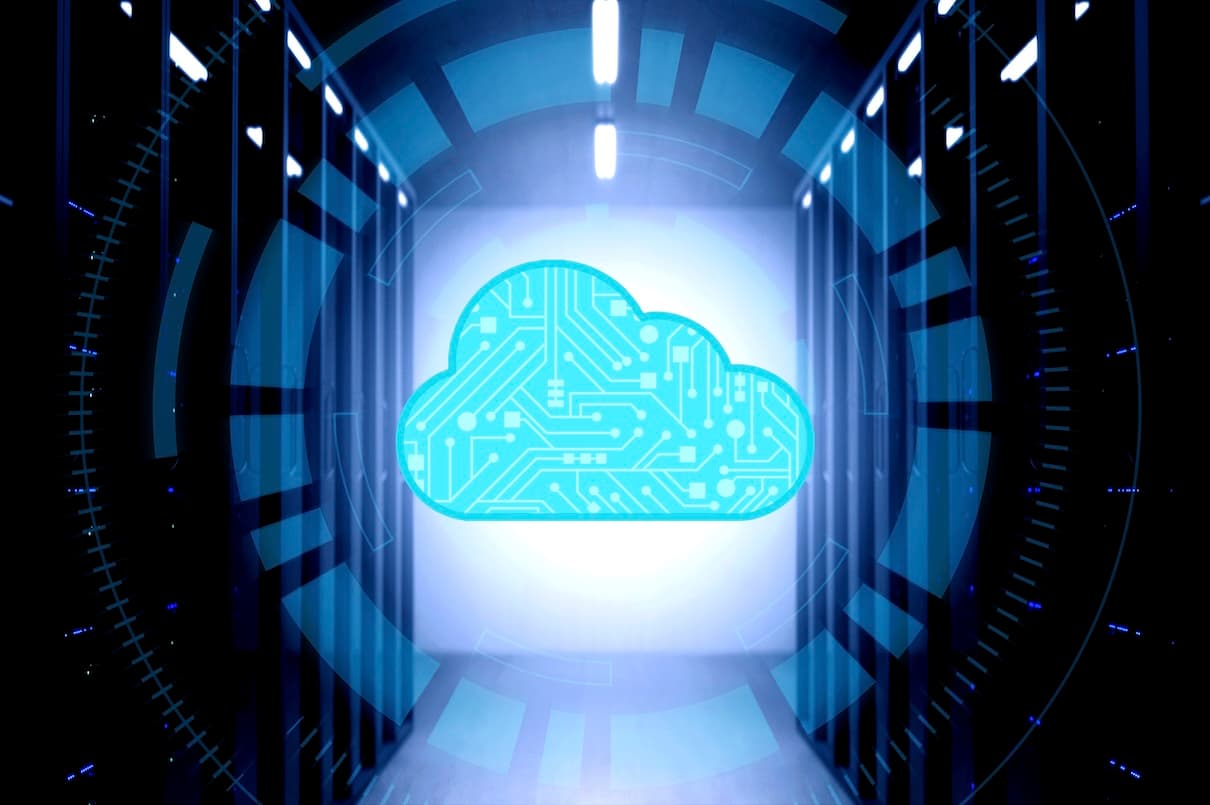 Futuristic server room with a glowing digital cloud icon in the center, symbolizing cloud computing and technological advancement. Futuristic server room with a glowing digital cloud icon in the center, symbolizing cloud computing and technological advancement.