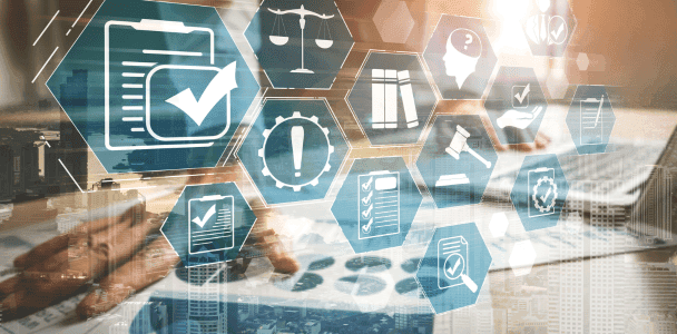 A person works on a laptop beneath transparent hexagons displaying icons for documents and checkmarks, symbolizing digital workflow and efficiency. A person works on a laptop beneath transparent hexagons displaying icons for documents and checkmarks, symbolizing digital workflow and efficiency.