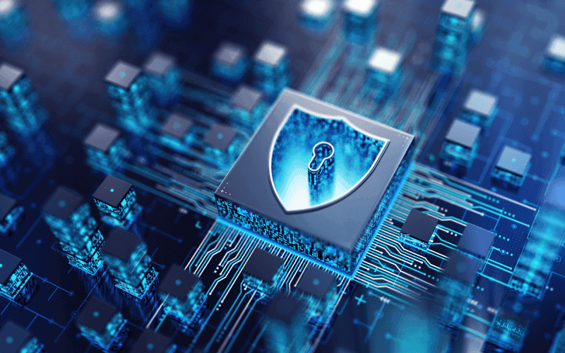 A digital circuit board with a central shield icon containing a keyhole, symbolizing cybersecurity. The blue tones convey a high-tech, secure atmosphere. A digital circuit board with a central shield icon containing a keyhole, symbolizing cybersecurity. The blue tones convey a high-tech, secure atmosphere.