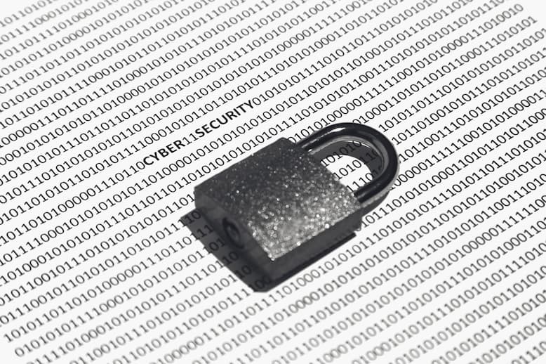 Closeup shot of a lock on a white surface with binary code on it. Closeup shot of a lock on a white surface with binary code on it.