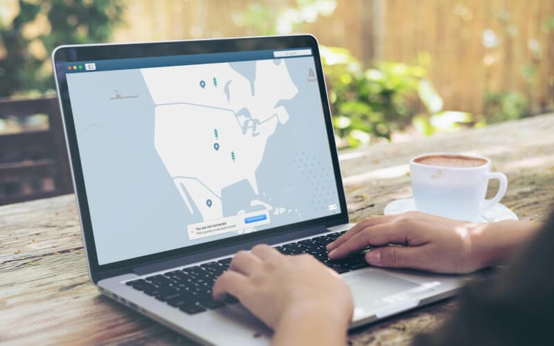 A person using a laptop with a map interface displaying a VPN connection, symbolizing secure remote access and proxy services. A person using a laptop with a map interface displaying a VPN connection, symbolizing secure remote access and proxy services.