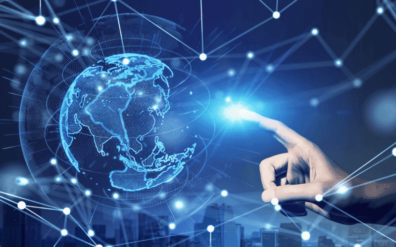 A hand reaches towards a glowing digital globe surrounded by interconnected lines and nodes, set against a cityscape. Futuristic and dynamic atmosphere. A hand reaches towards a glowing digital globe surrounded by interconnected lines and nodes, set against a cityscape. Futuristic and dynamic atmosphere.